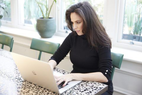 Samantha Senior working at her laptop